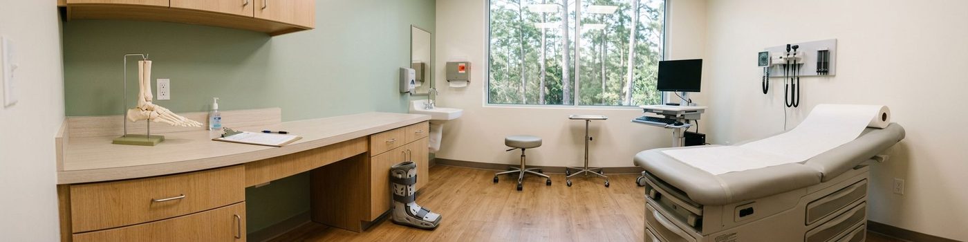 Foot and ankle exam room with a skeletal foot model and walking boot