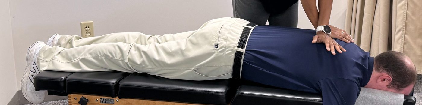 Dr. Kesia Broome adjusting a patient